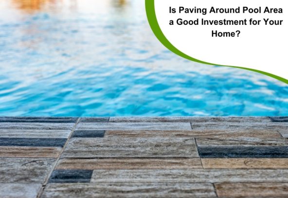 A close-up of paving around a pool area, showing textured tiles leading to blue water.